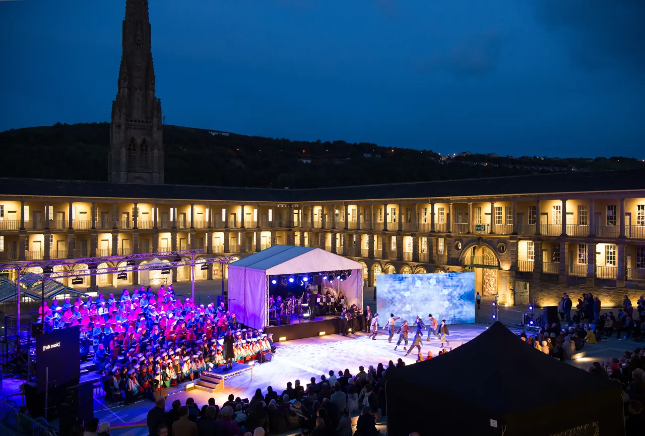 Piece Hall at night hosting illuminated outdoor performance in historic public square with flexible civic landscape design