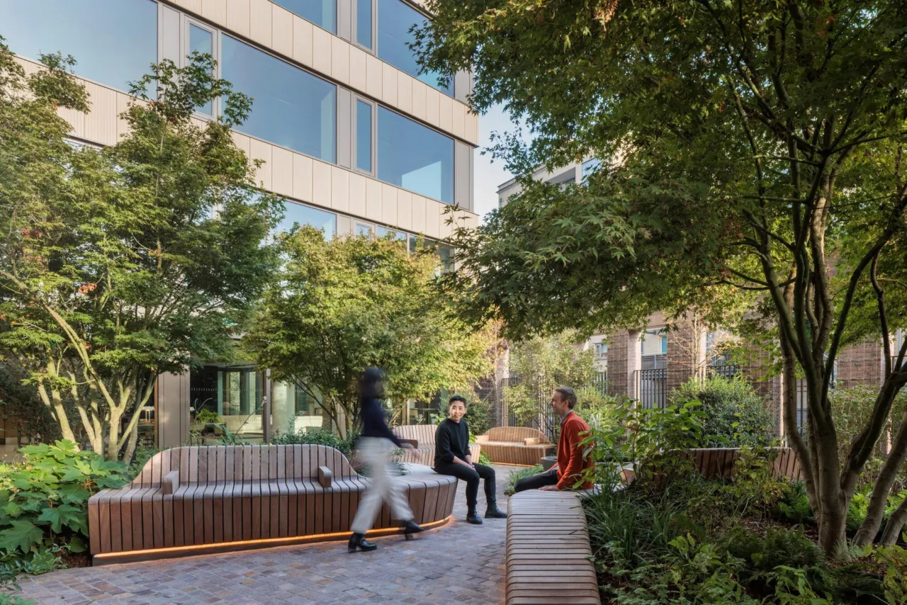 Lush courtyard garden at 11 Belgrave Road with integrated seating and green planting