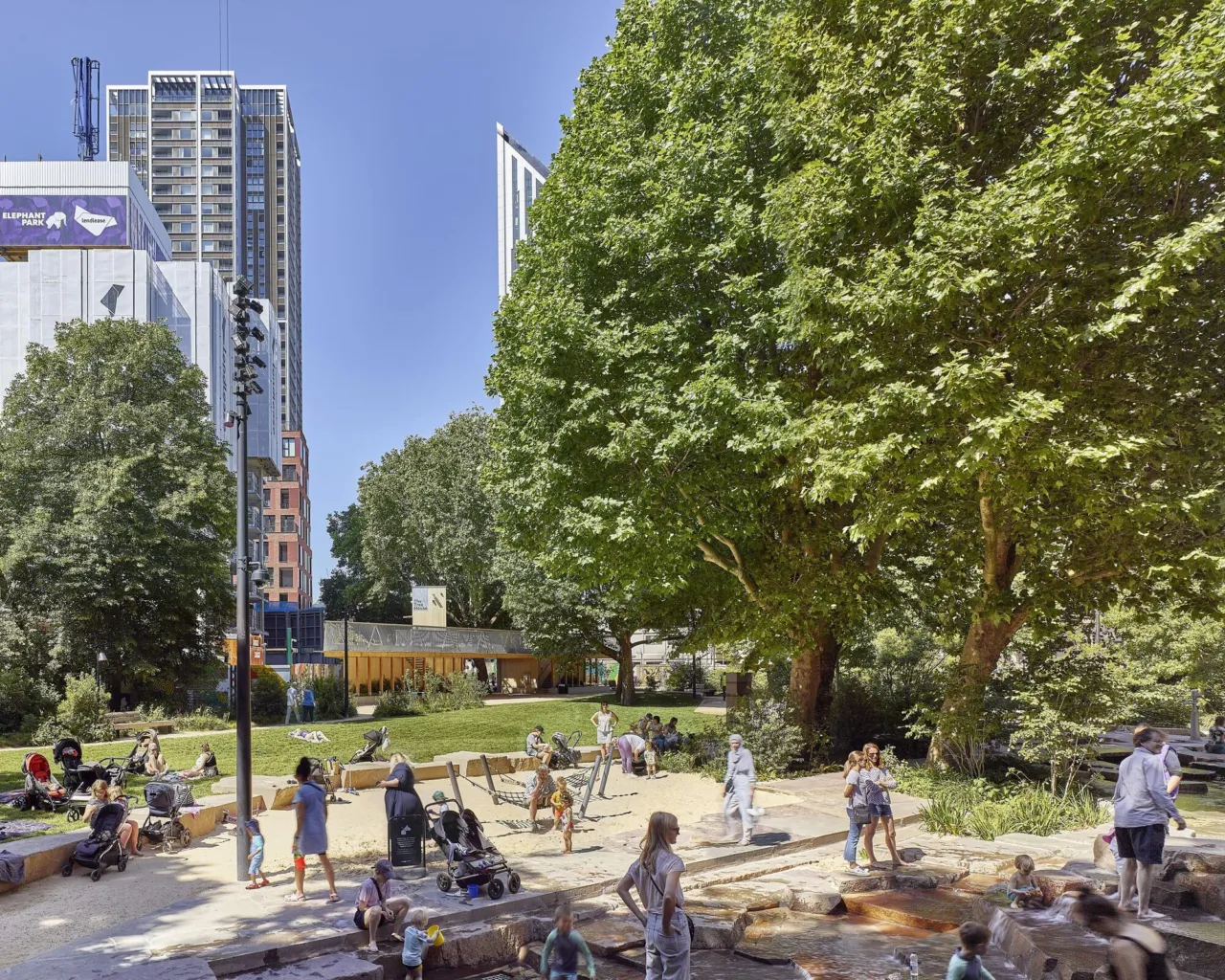 View of children playing at Elephant Springs waterscape in Elephant Park London
