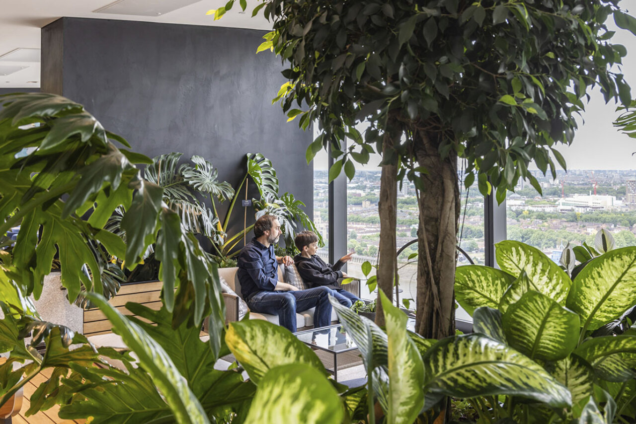 People in indoor garden at Landmark Pinnacle