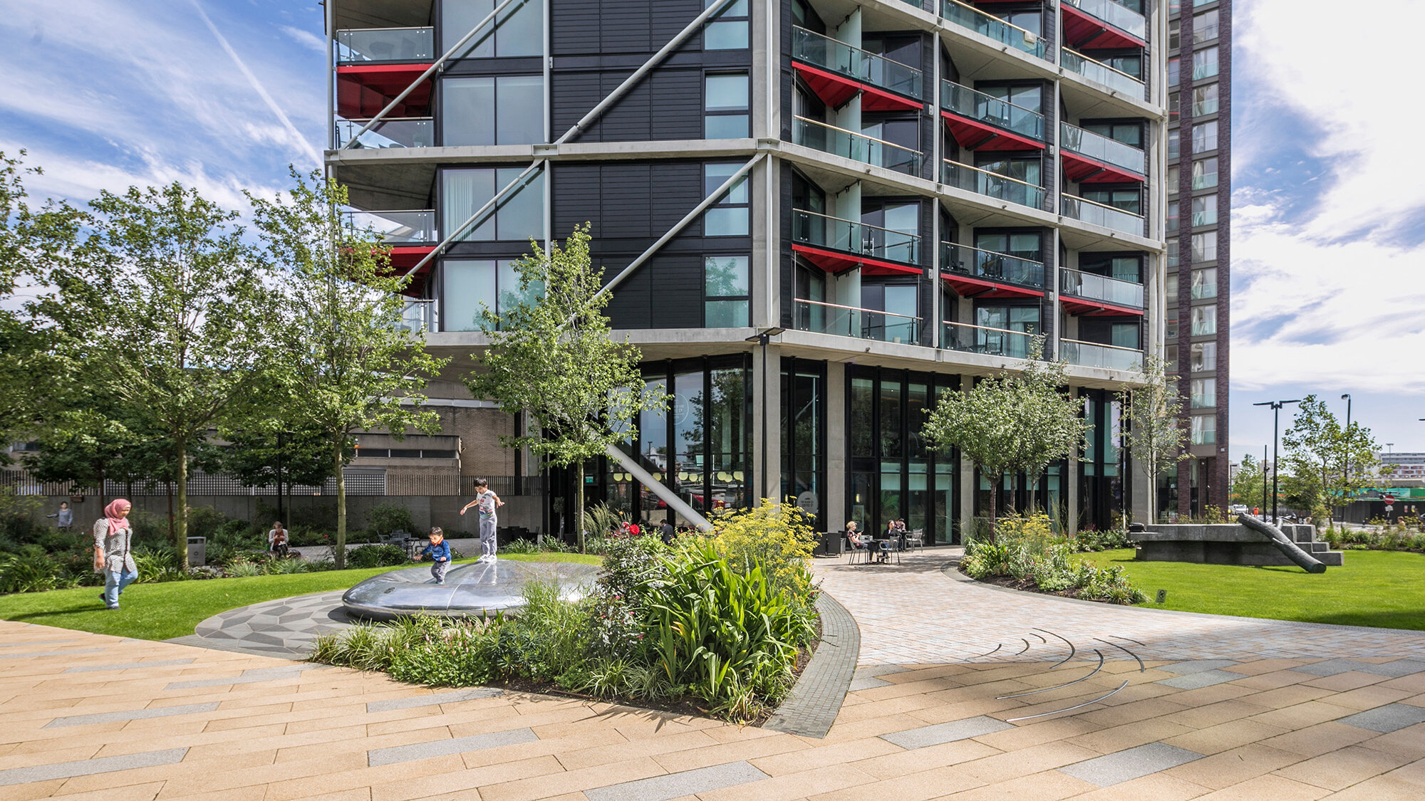Riverlight residential landscape in South London with play area, lawns, and planting designed by Gileespies landscape architects.