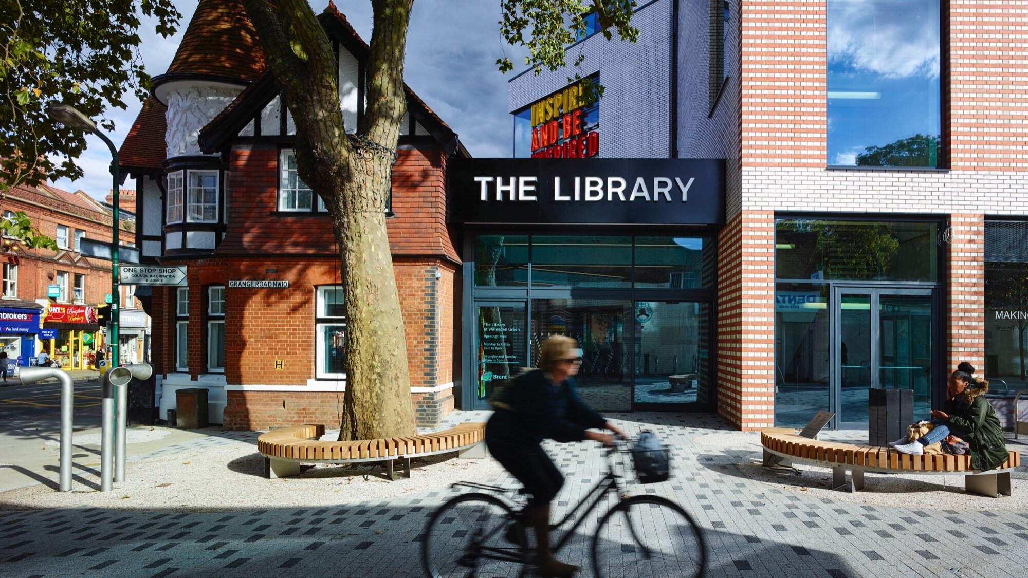 Willesden Green Library public realm with urban landscaping, integrated seating, and tree planting for placemaking.