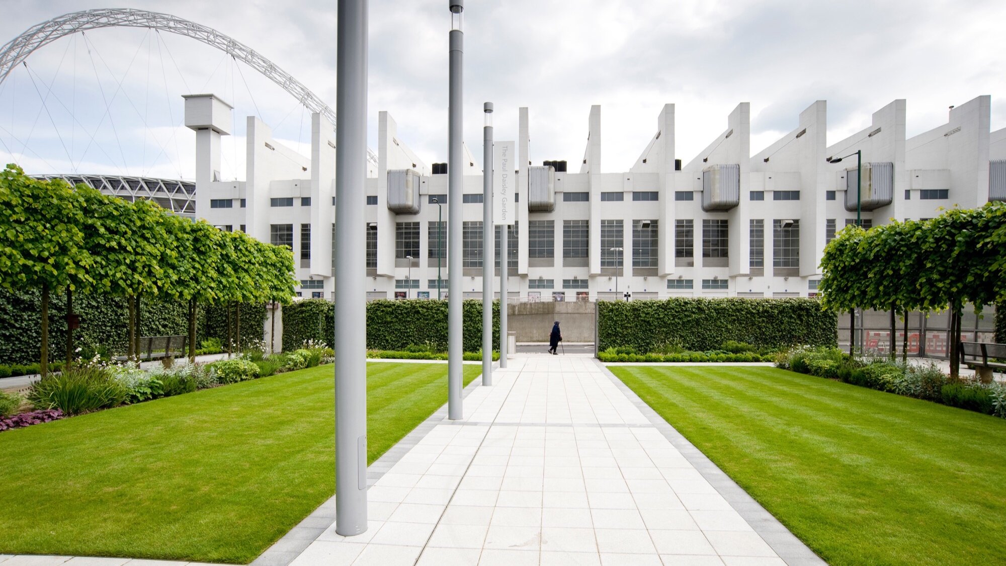 Brent Civic Centre landscape design with pleached trees, formal lawns, and linear paving framing iconic Wembley architecture.