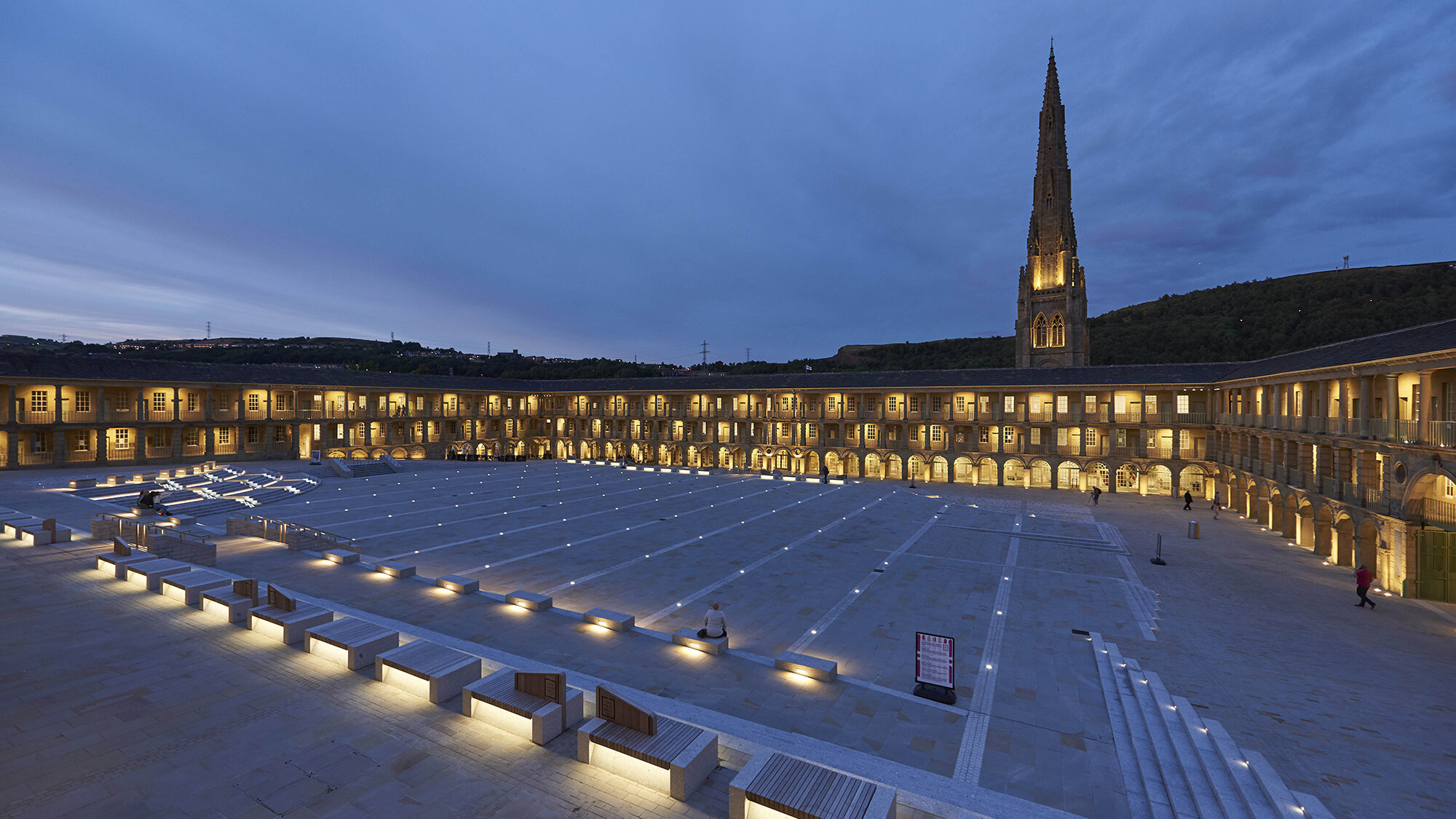 Piece Hall landscape regeneration in Halifax with illuminated stone plaza, heritage architecture, and integrated public realm design by Gillespies