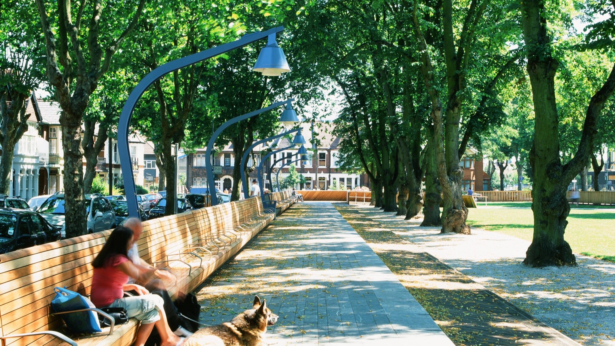 Linear park design at Warrior Square Gardens with tree-lined promenade, bespoke seating, and integrated urban landscape architecture.