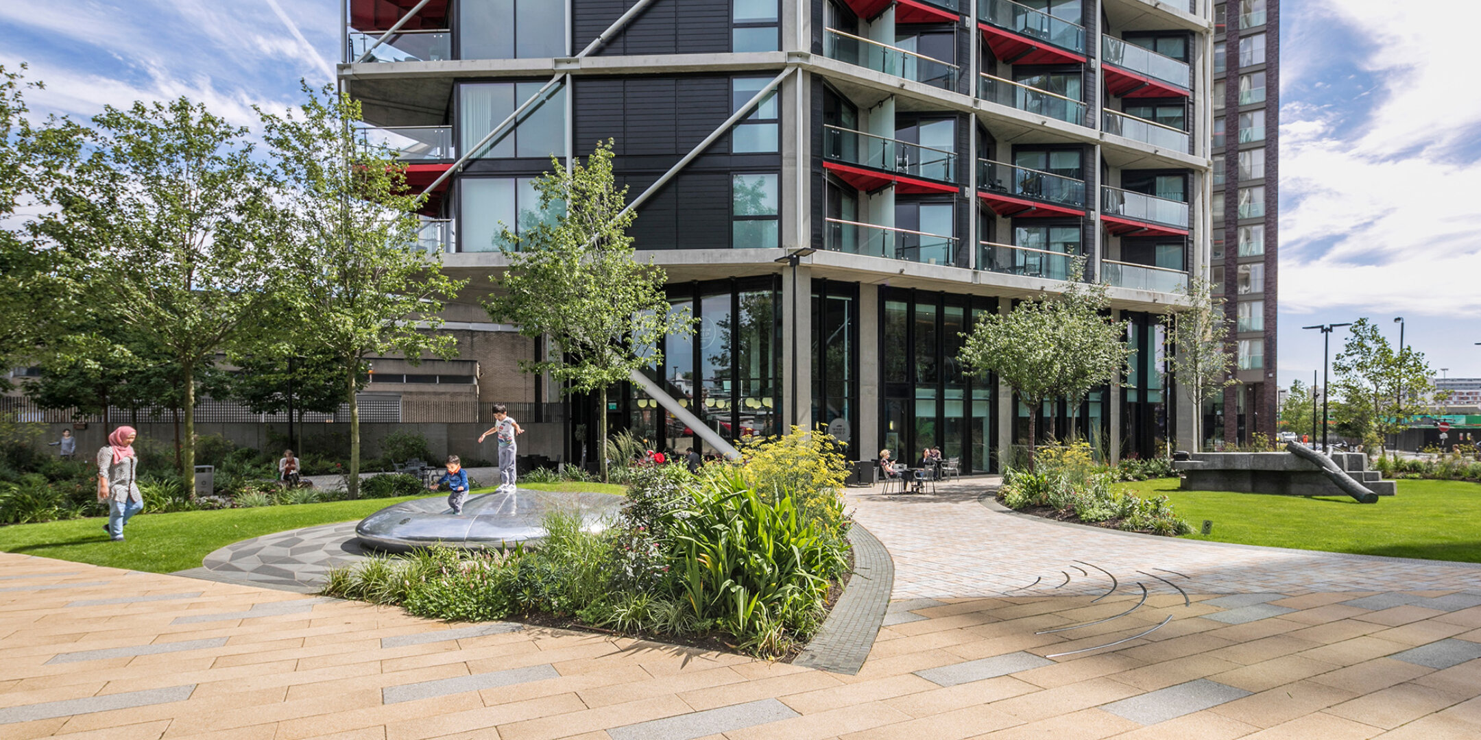 Riverlight residential landscape in South London with play area, lawns, and planting designed by Gileespies landscape architects.