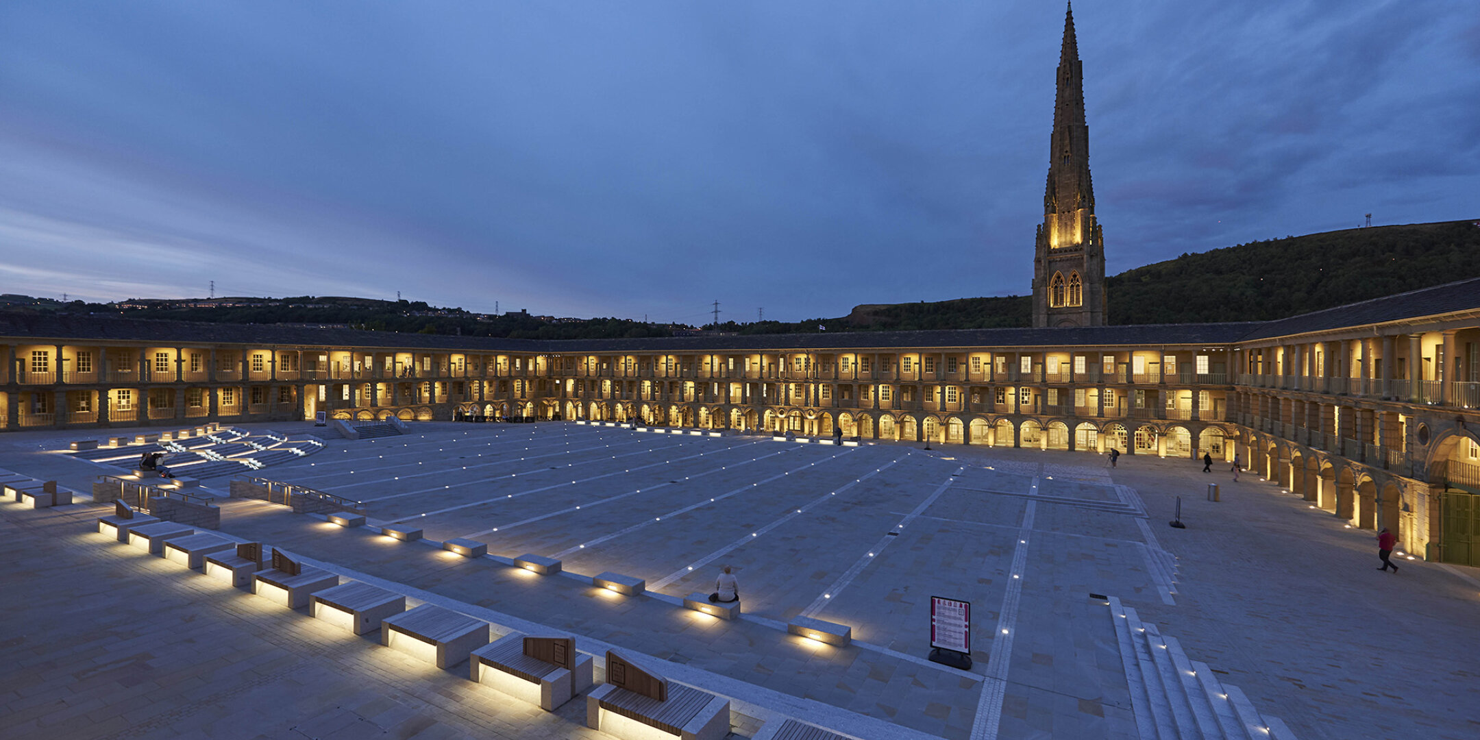 Piece Hall landscape regeneration in Halifax with illuminated stone plaza, heritage architecture, and integrated public realm design by Gillespies