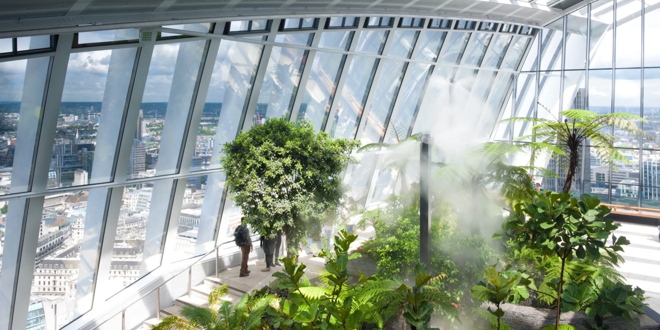 Sky Garden planting with tropical vegetation, misting system, and panoramic views illustrating sustainable indoor landscape architecture.