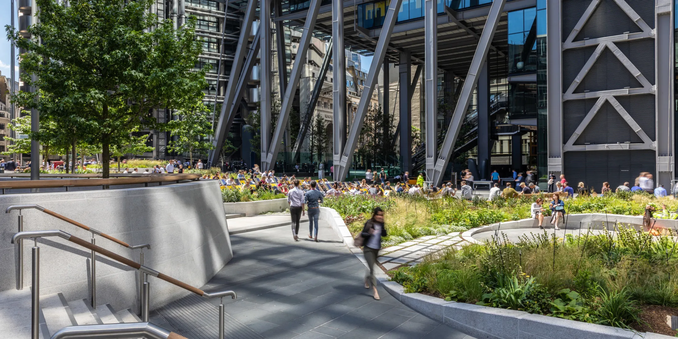 Modern landscape architecture at St Helen’s Square with tiered planting, stone paving, and integrated seating in City of London.