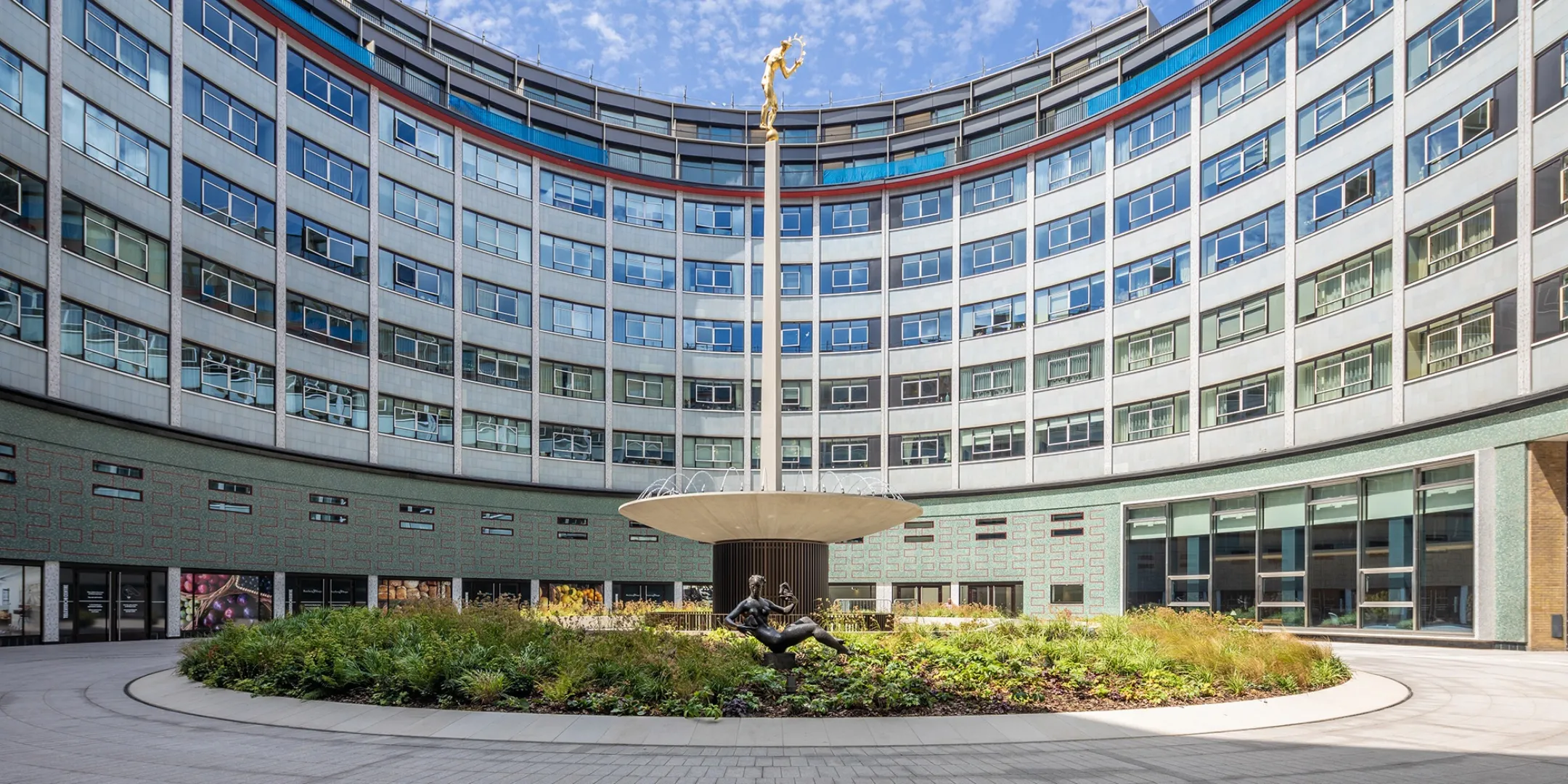 Television Centre circular courtyard with central statue, planting beds, and modern landscape architecture in urban public realm design