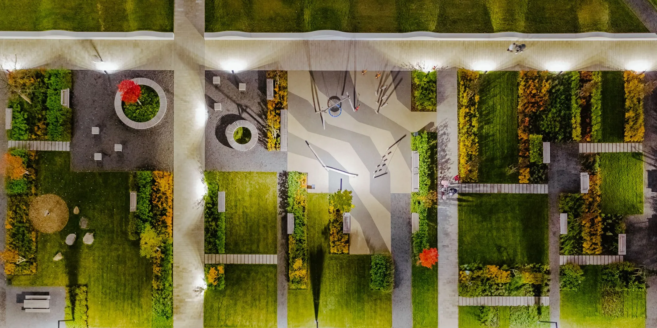 Aerial view of contemporary urban landscape design at Varshavskoe Shosse featuring geometric planting, paths, and seating zones.