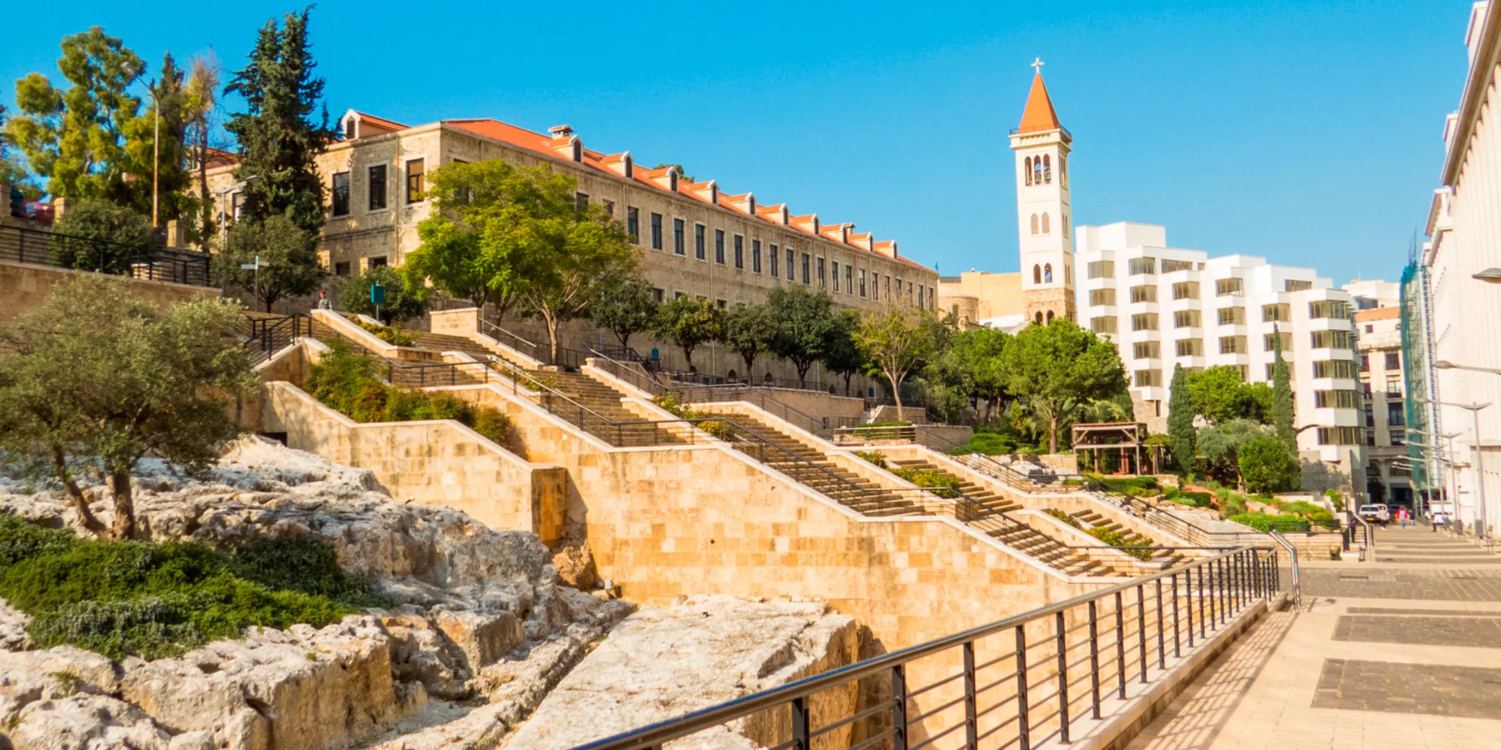Urban landscape design of Roman Baths in Beirut featuring terraced stone steps, archaeological ruins, and Mediterranean planting.