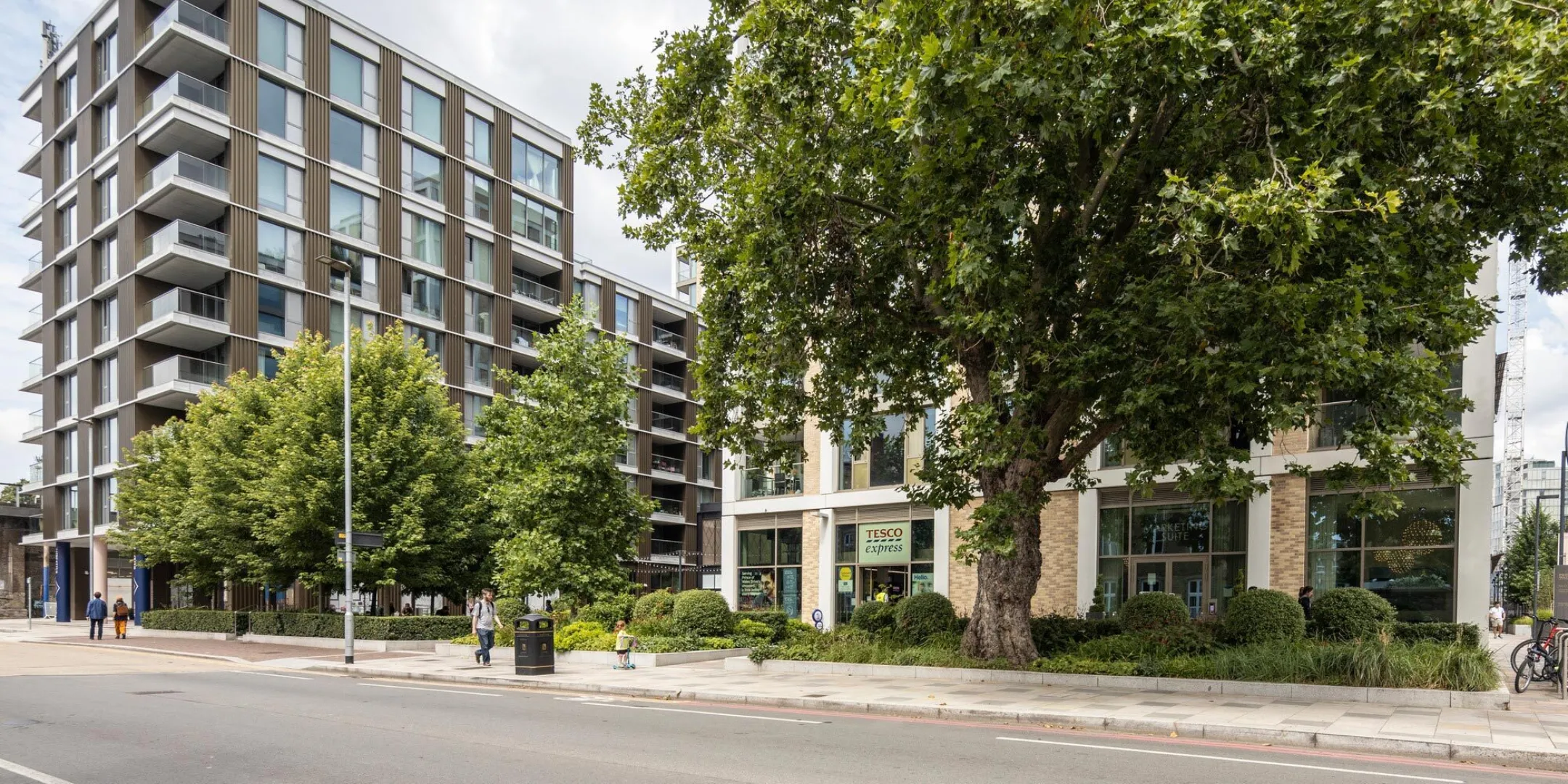 Street view of leafy Prince of Wales Drive with landscape design by Gillespies