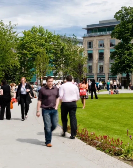 St Andrew Square with active public realm, formal lawn, seating, pavilion café and accessible pathways designed for urban landscape engagement.