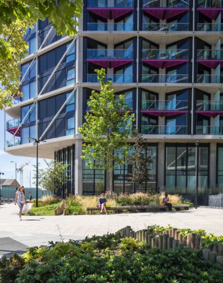 Riverlight South London residential development with landscaped public seating, planting design, and modern riverside urban realm architecture.