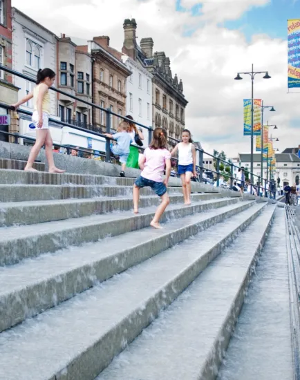 Darlington Pedestrian Heart with wide stone step playful water feature and integrated landscape architecture in town centre.
