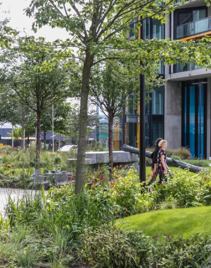 Lush green planting and seating areas at Riverlight residential landscape in South London.