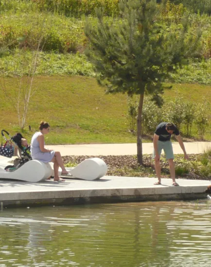Contemporary waterfront landscape at Southwater One with sculptural seating, family-friendly design, and biodiverse planting.