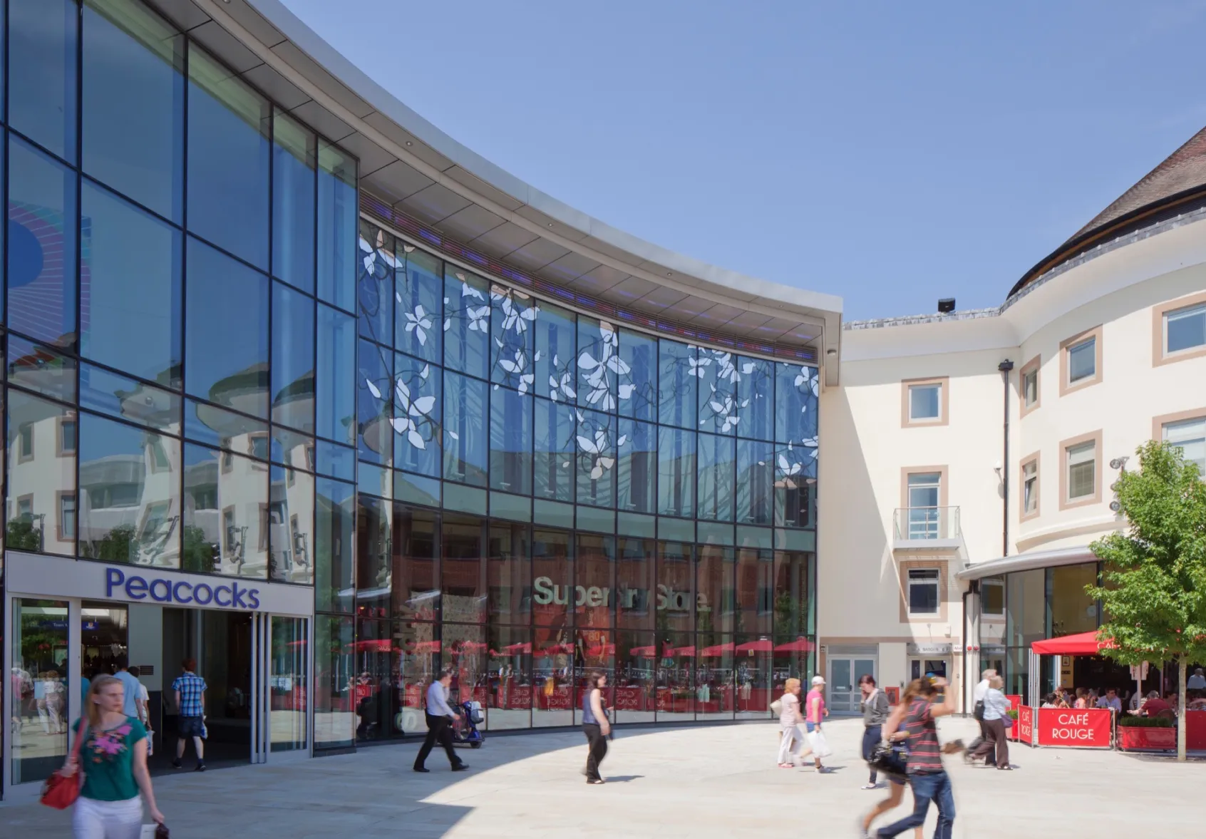Woking Jubilee Square public realm with retail, cafes, and modern landscape architecture for urban placemaking