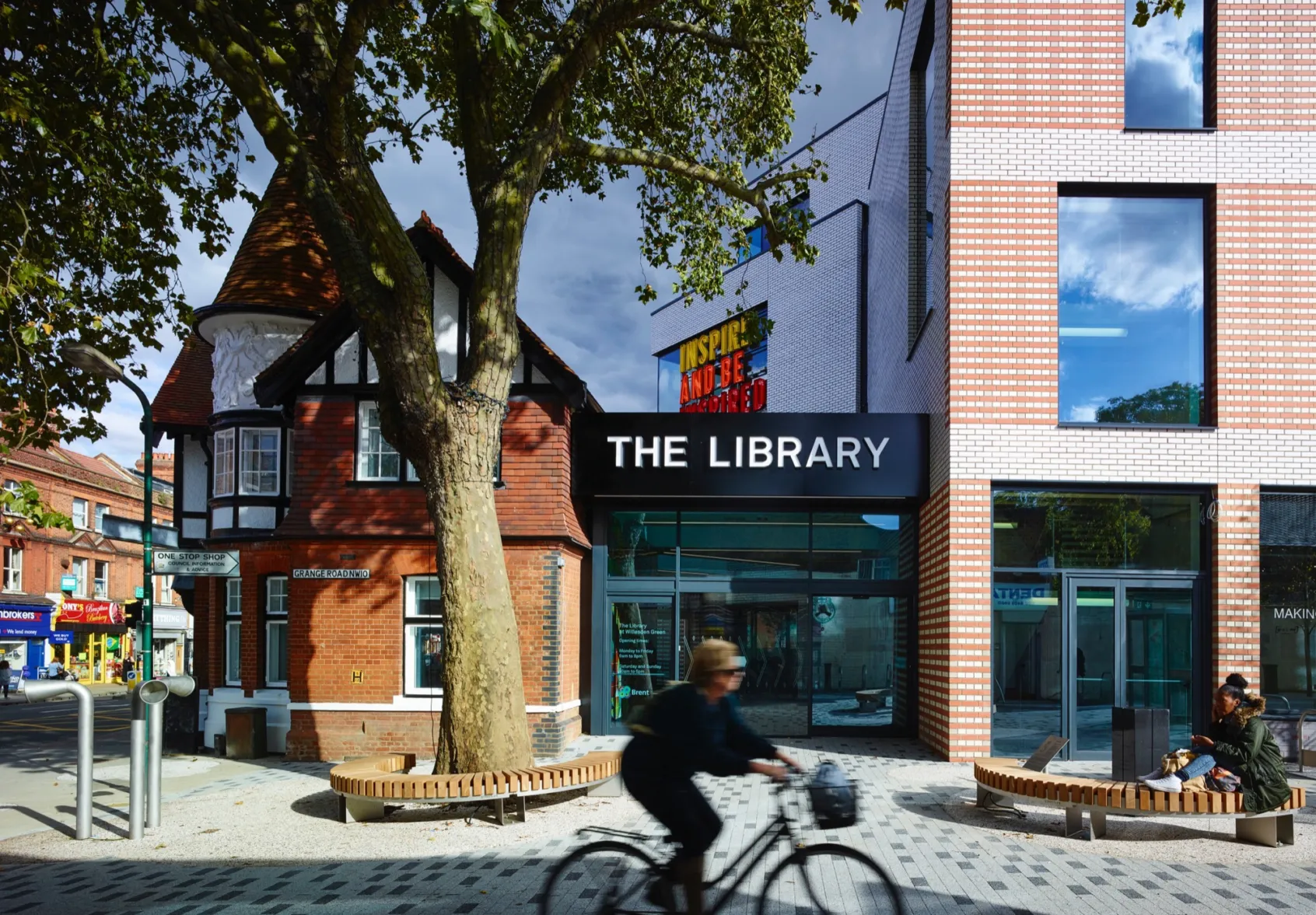 Willesden Green Library public realm with urban landscaping, integrated seating, and tree planting for placemaking.