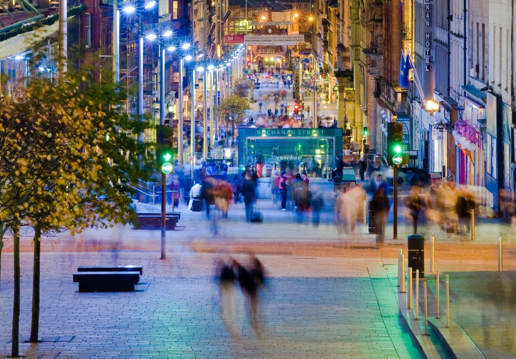 Evening streetscape of Buchanan Street Glasgow with urban lighting, pedestrian-friendly paving, and landscape architecture design.