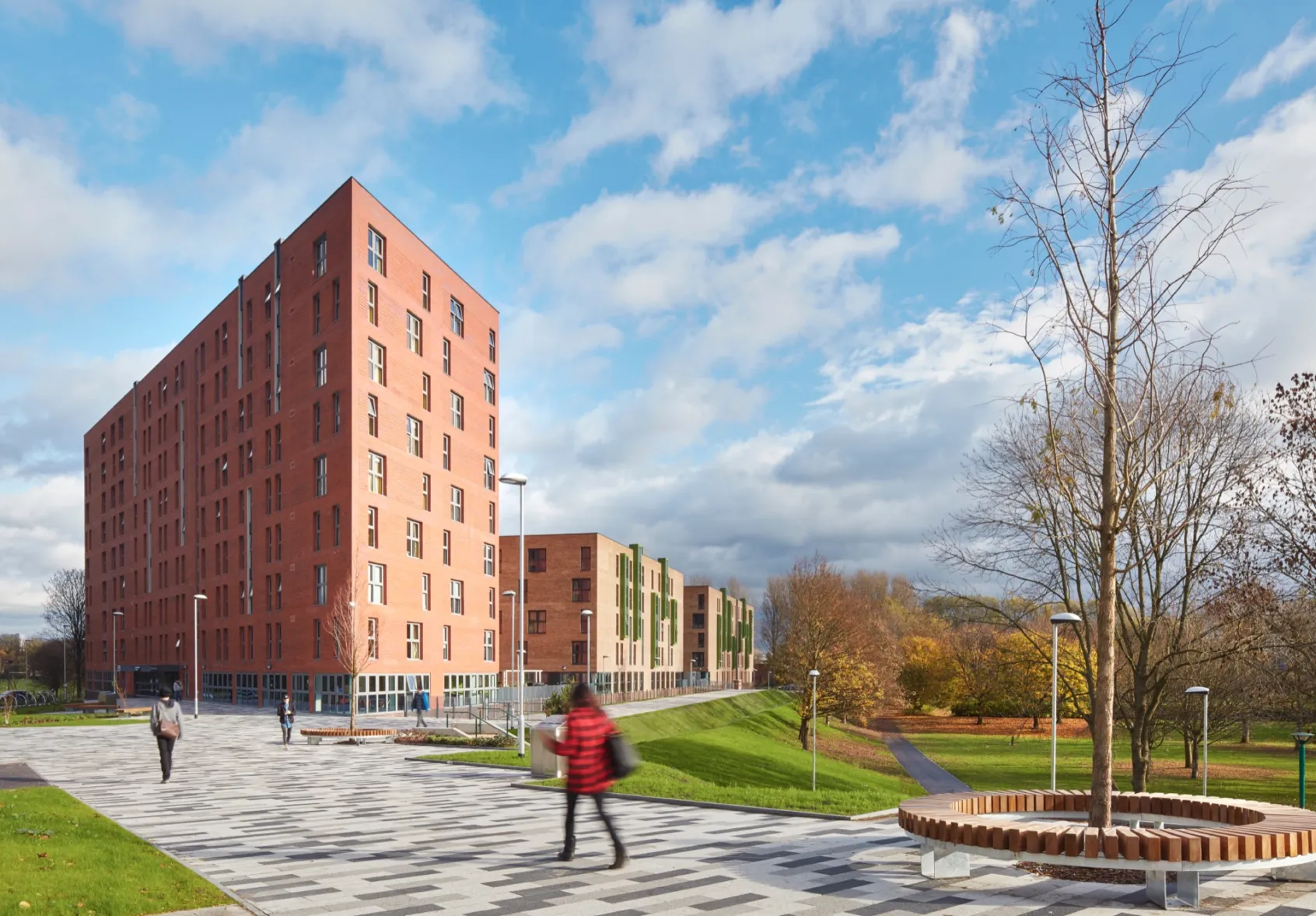 Peel Park Quarter public realm design with modern paving, tree planting, and contemporary street furniture for student housing landscape.