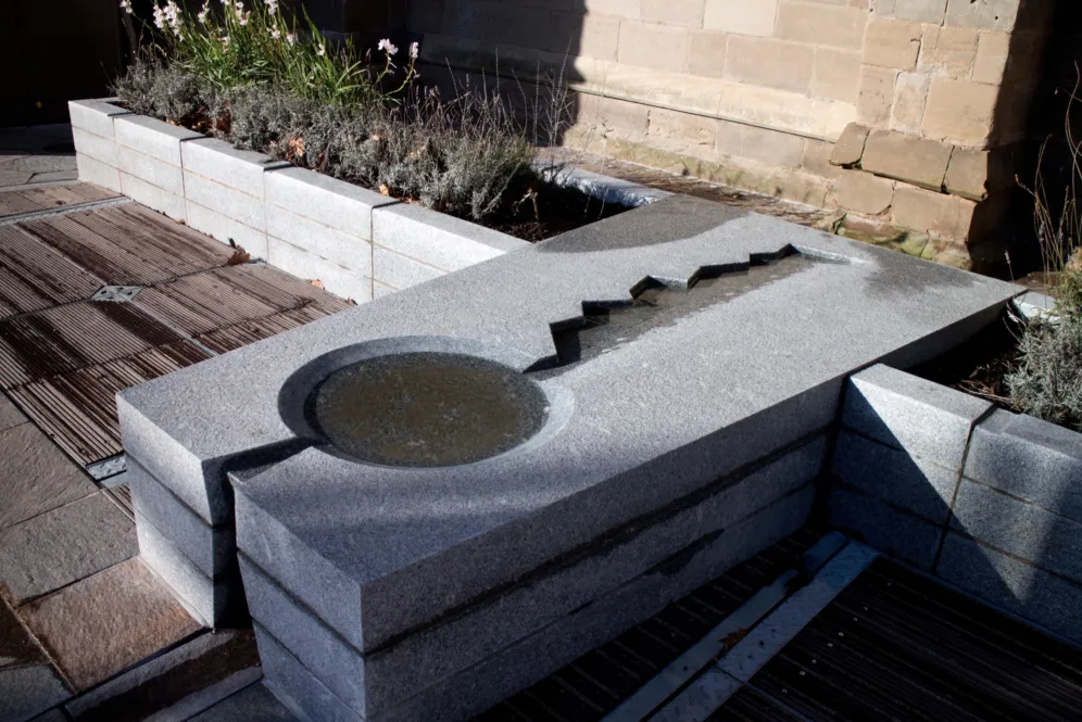 Contemporary stone water feature at Leicester Cathedral Gardens showcasing historic interpretation through landscape architecture design.