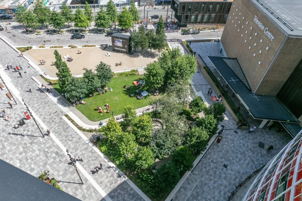 Aerial view of a contemporary residential courtyard with landscaped gardens, terraces and walkways.