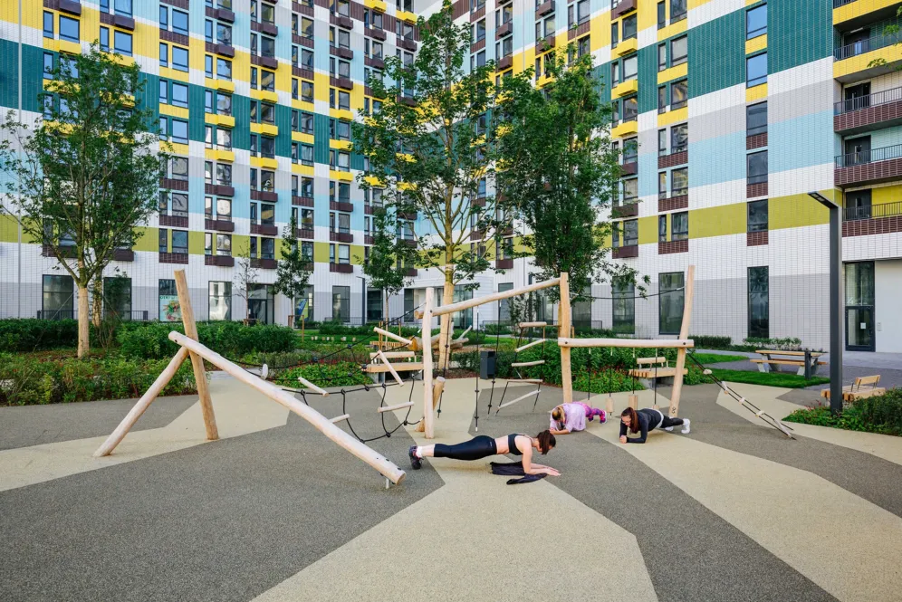 Outdoor flexible area at Varshavskoe Shosse with natural play elements and contemporary urban landscape architecture promoting active lifestyles.