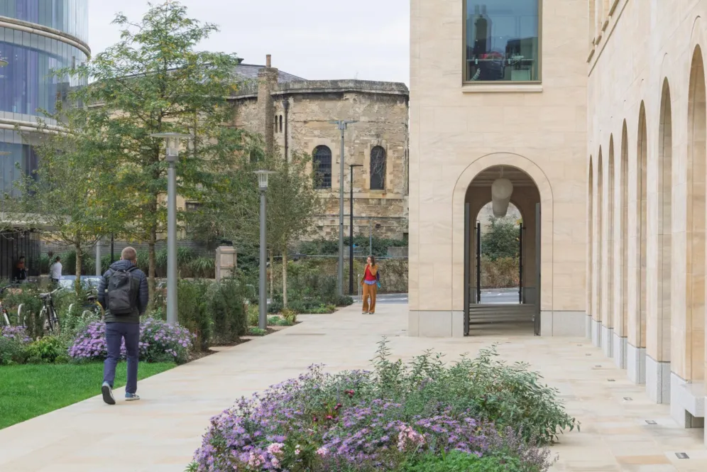 Oxford Humanities Building landscape with stone colonnade, pedestrian courtyard, and soft planting demonstrating contemporary academic landscape architecture.