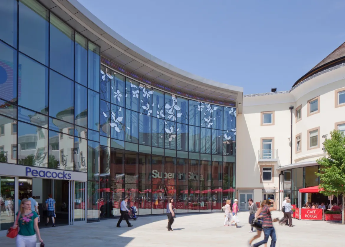 Woking Jubilee Square public realm with retail, cafes, and modern landscape architecture for urban placemaking