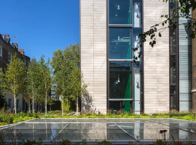 Landscape architecture at British Museum WCEC with urban courtyard planting, trees, and integrated skylight design.