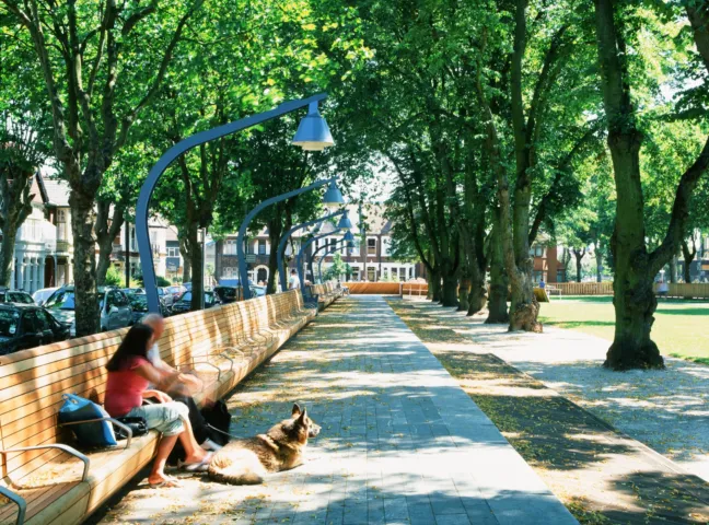 Linear park design at Warrior Square Gardens with tree-lined promenade, bespoke seating, and integrated urban landscape architecture.
