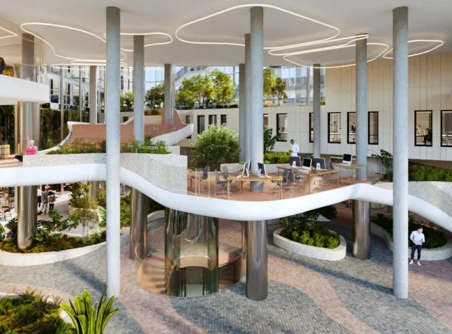 Interior of Danube House, an office development in Prague with lush internal planting, floating staircase and sculptural architectural design.