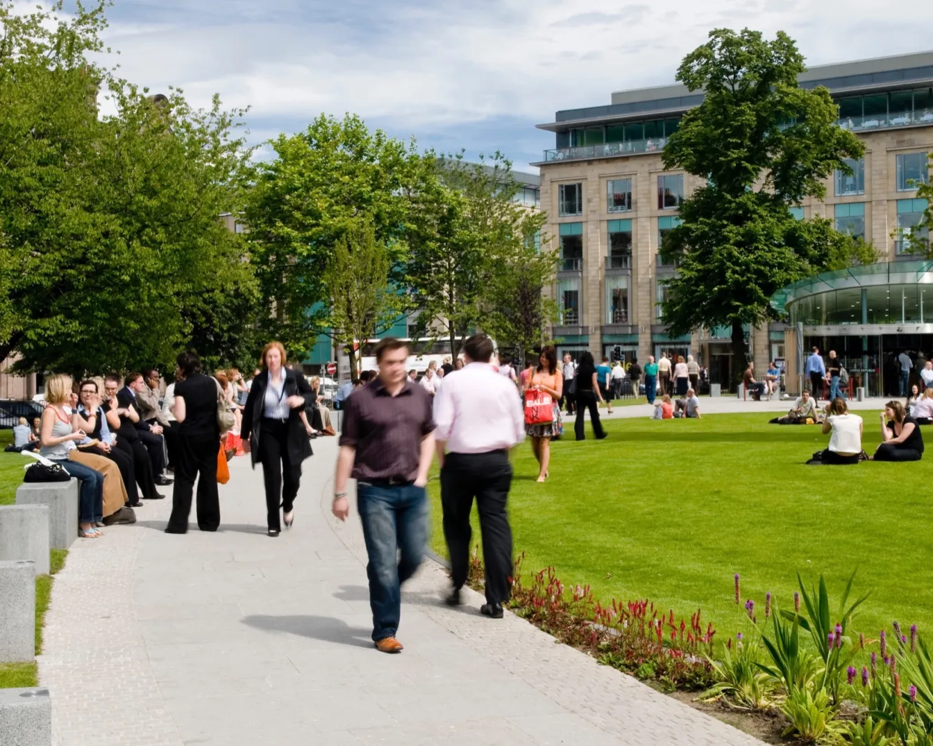 St Andrew Square with active public realm, formal lawn, seating, pavilion café and accessible pathways designed for urban landscape engagement.