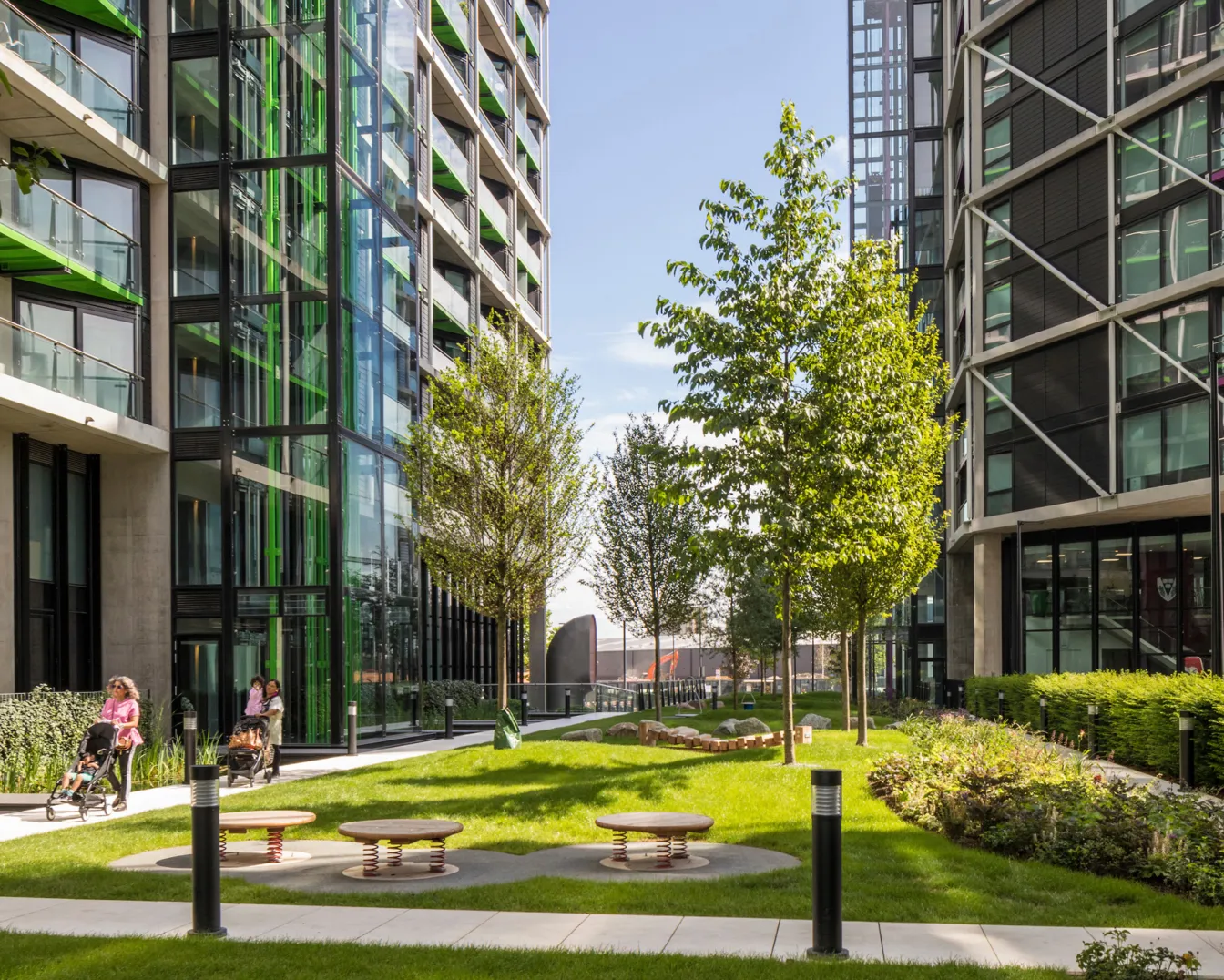 Riverlight South London landscaped courtyard with modern planting, play elements, and green public space by landscape architects.