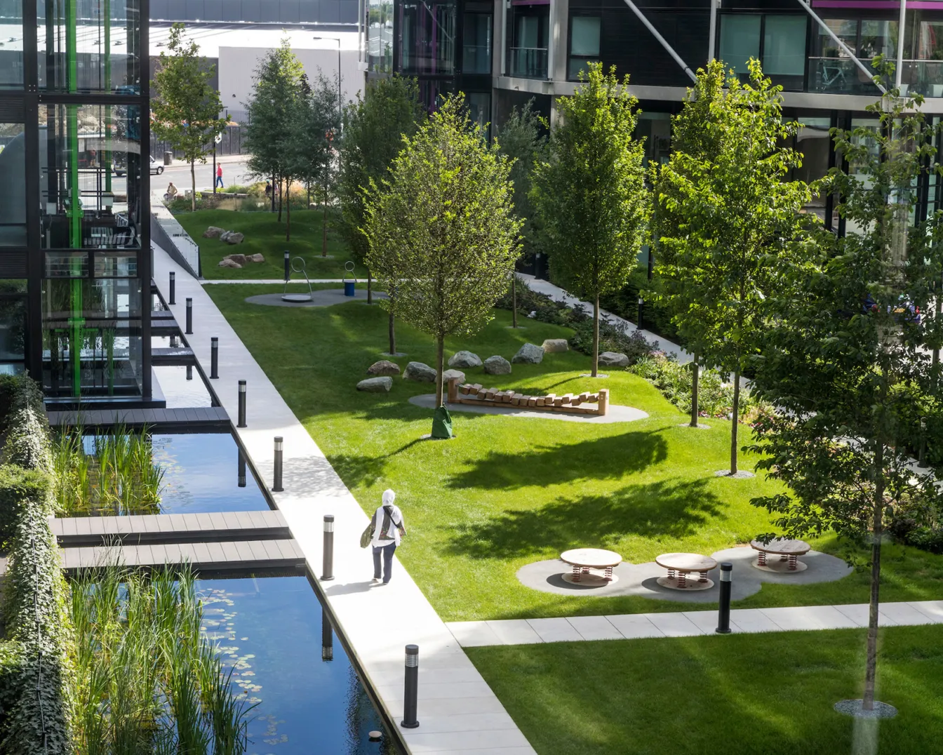 Riverlight South London landscape design with water features, lawns, trees, and seating areas by landscape architects.