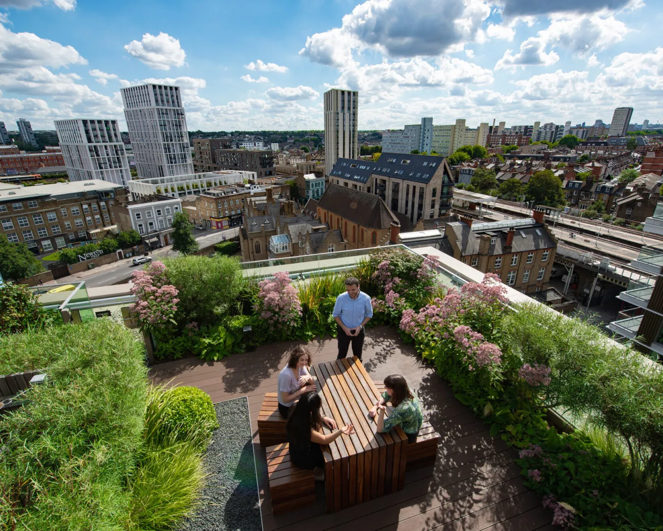 Roof terrace with people sitting at a table at Prince of Wales Drive