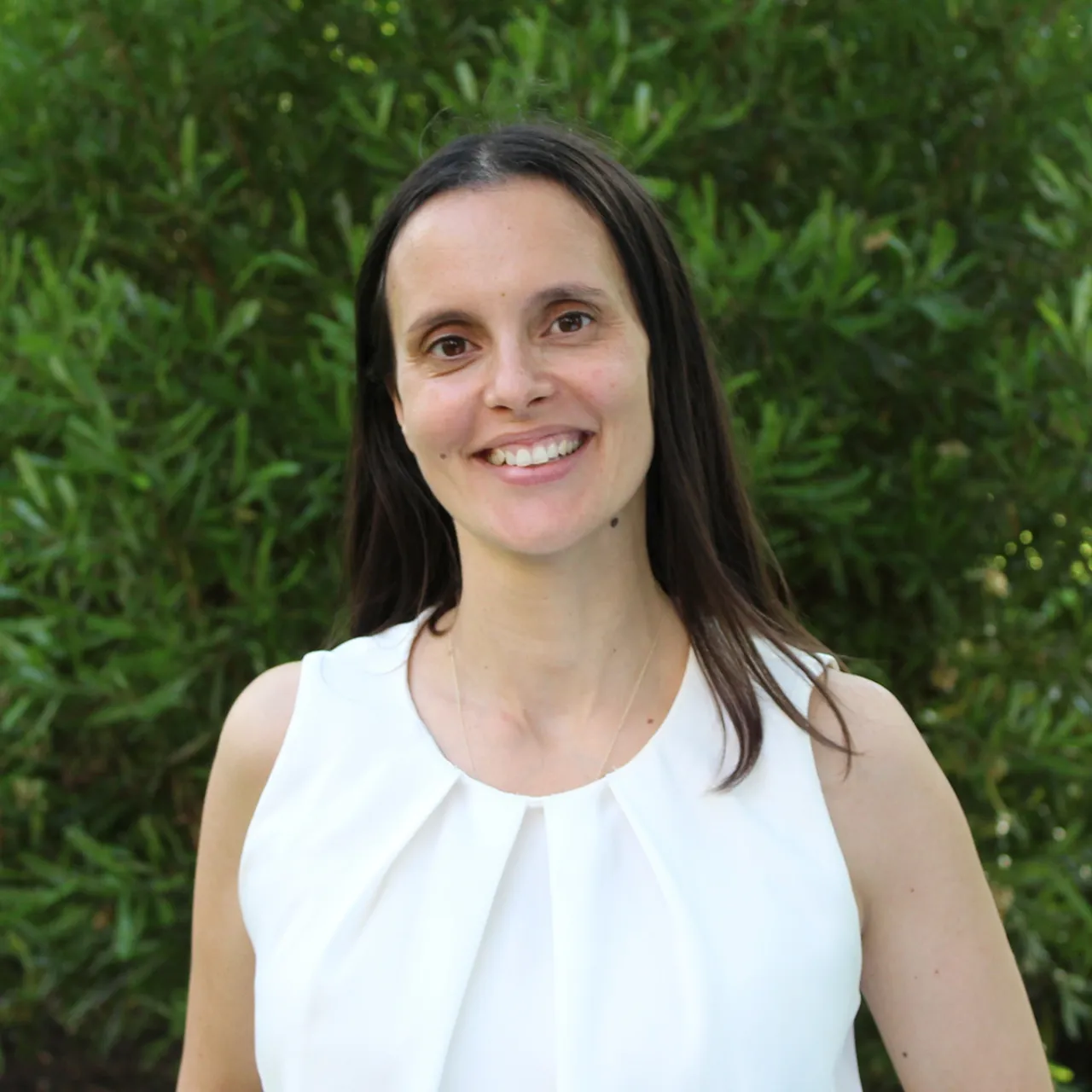 Joana Quintas, Senior Landscape Architect at Gillespies' London studio, smiling in a parkland setting