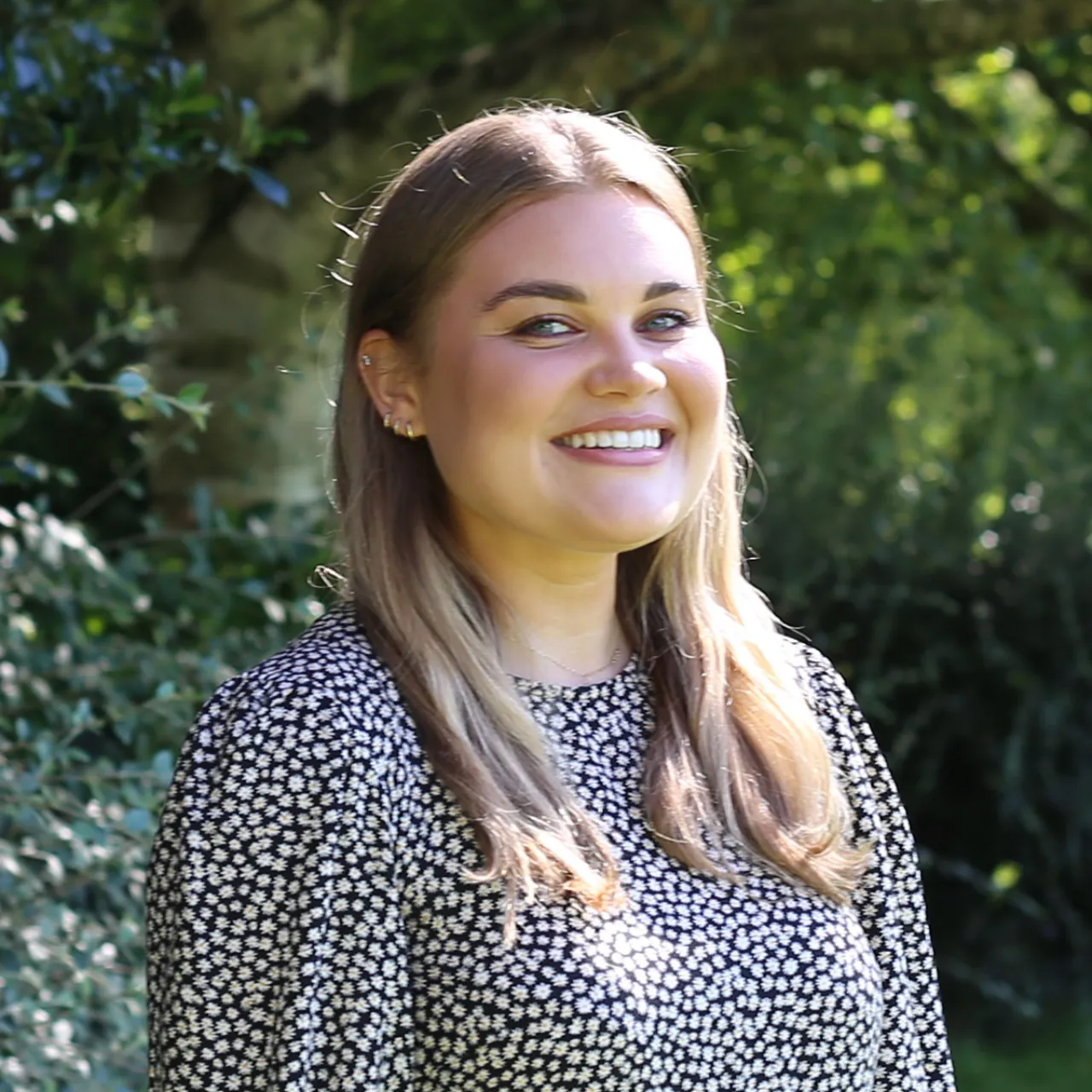 Bethany Keel, Senior Landscape Architect in Manchester, smiling in a parkland setting
