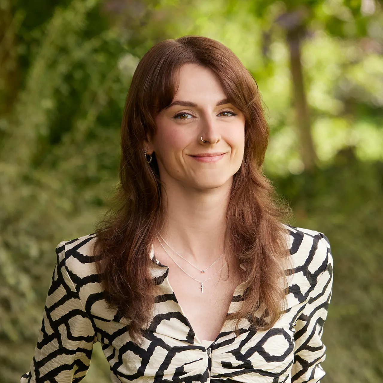 Holly Partlett, Graduate Urban Designer at Gillespies' Manchester studio, smiling in a parkland landscape