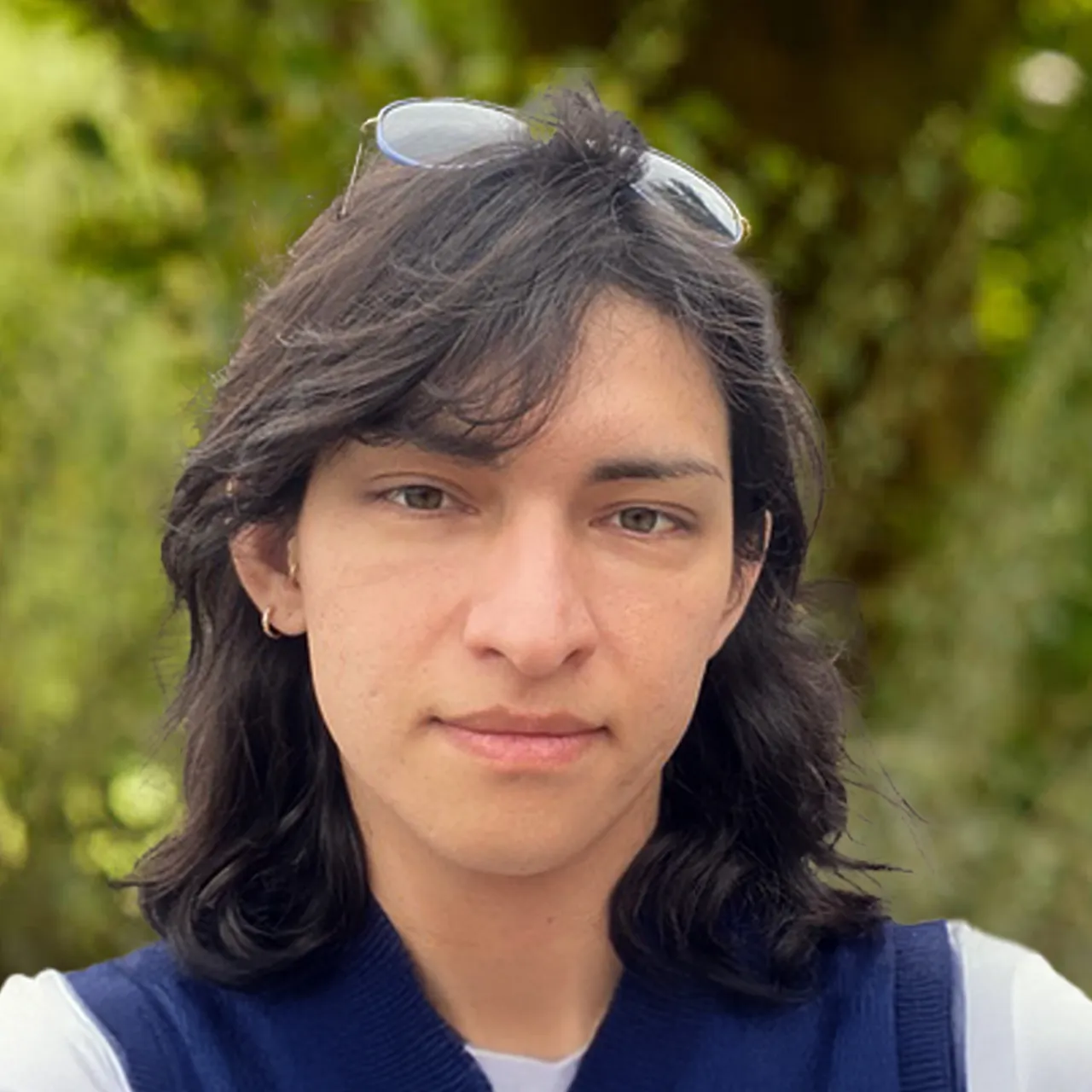Headshot of Sebastian Torres, BIM technician, standing in a parkland setting
