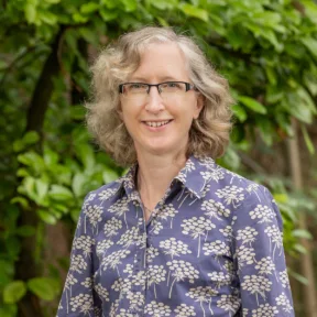 Sheena Bell, an Associate Partner in Gillespies' Oxford studio and BNG expert, smiling in a park in Oxford