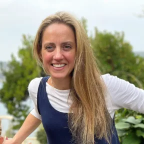 Samantha Leathers, Associate Partner and Head of Landscape Planning for the south region, smiling in a green setting